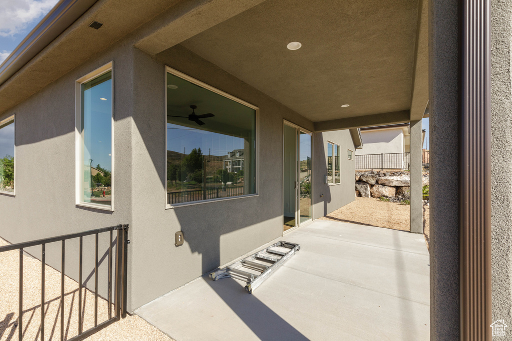 View of patio featuring ceiling fan