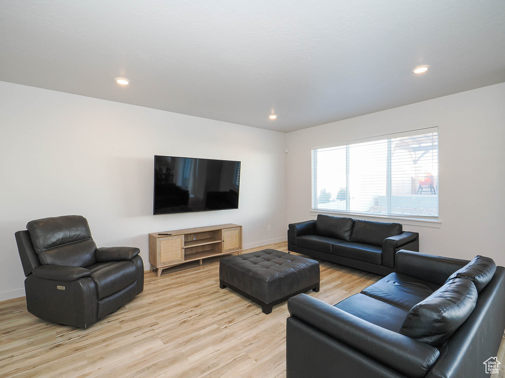 Living room with light wood-type flooring