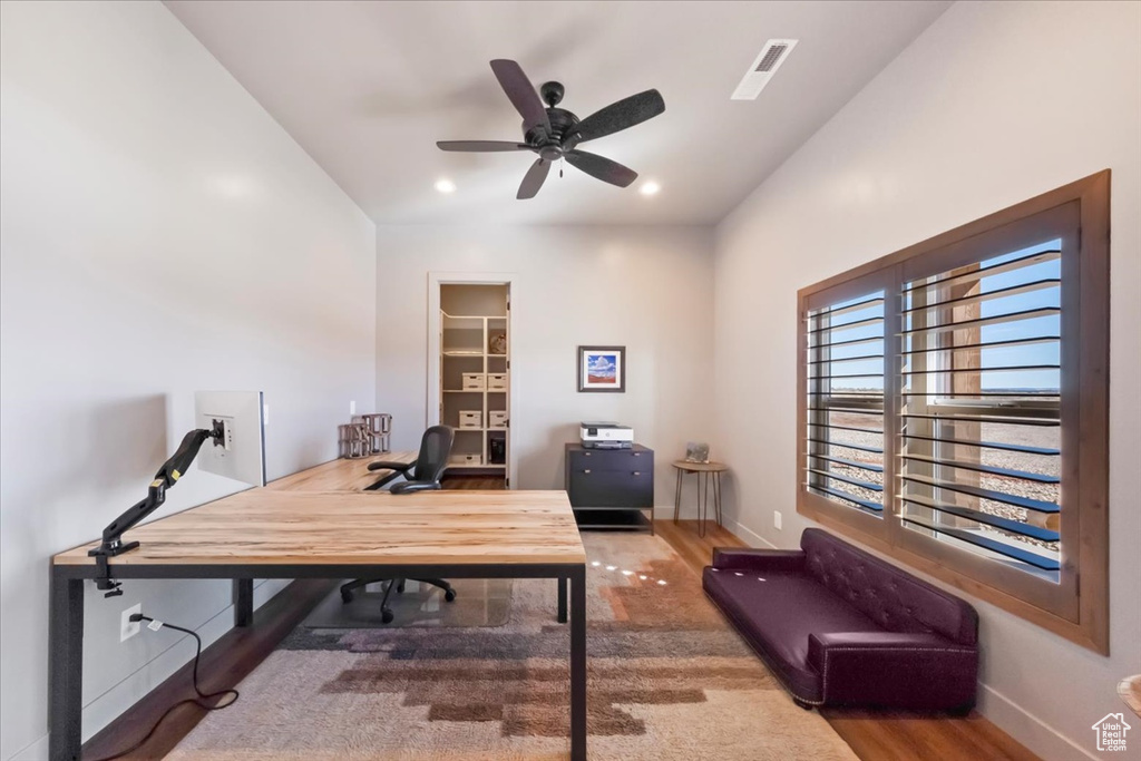 Office with hardwood / wood-style floors, ceiling fan, and lofted ceiling