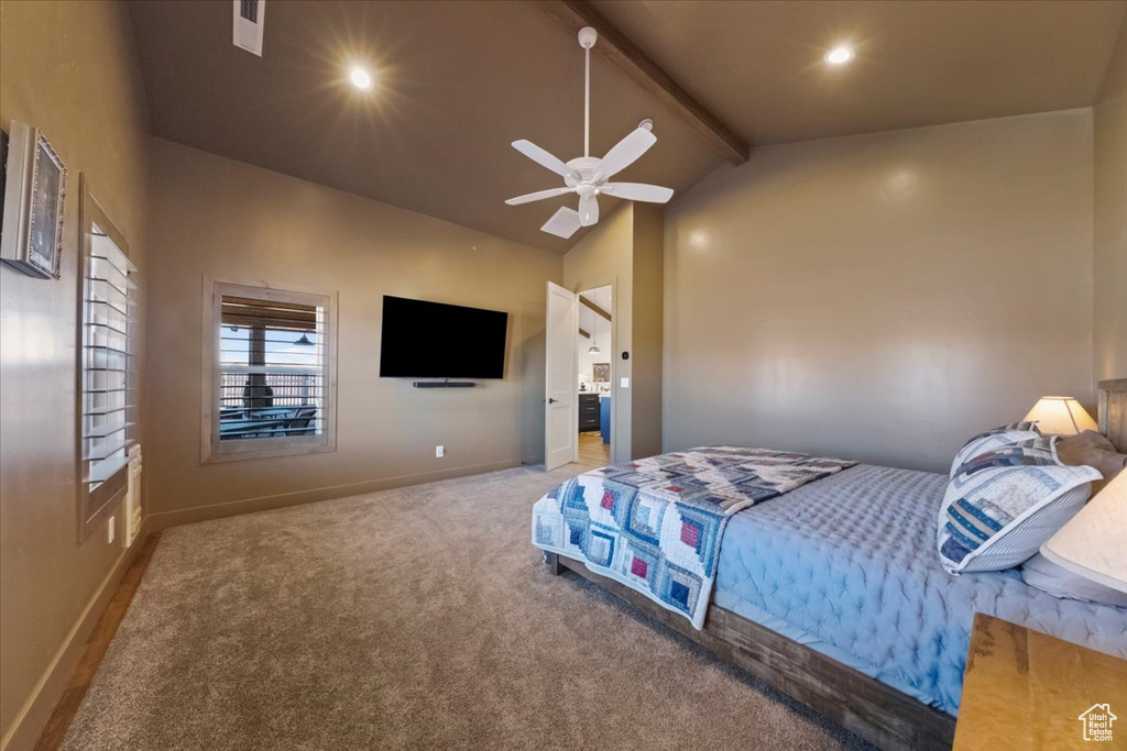Carpeted bedroom with high vaulted ceiling, ceiling fan, and beam ceiling