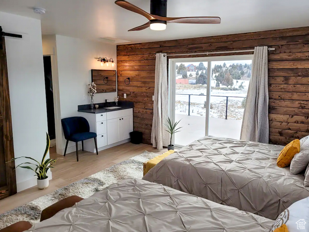 Bedroom featuring access to exterior, ceiling fan, and light wood-type flooring