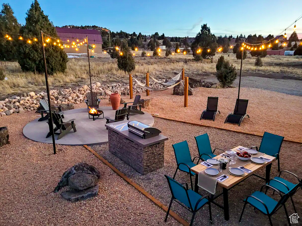 View of patio / terrace featuring an outdoor fire pit
