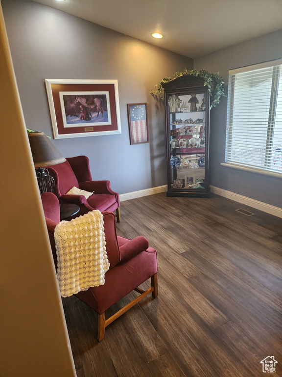 Sitting room with dark hardwood / wood-style floors