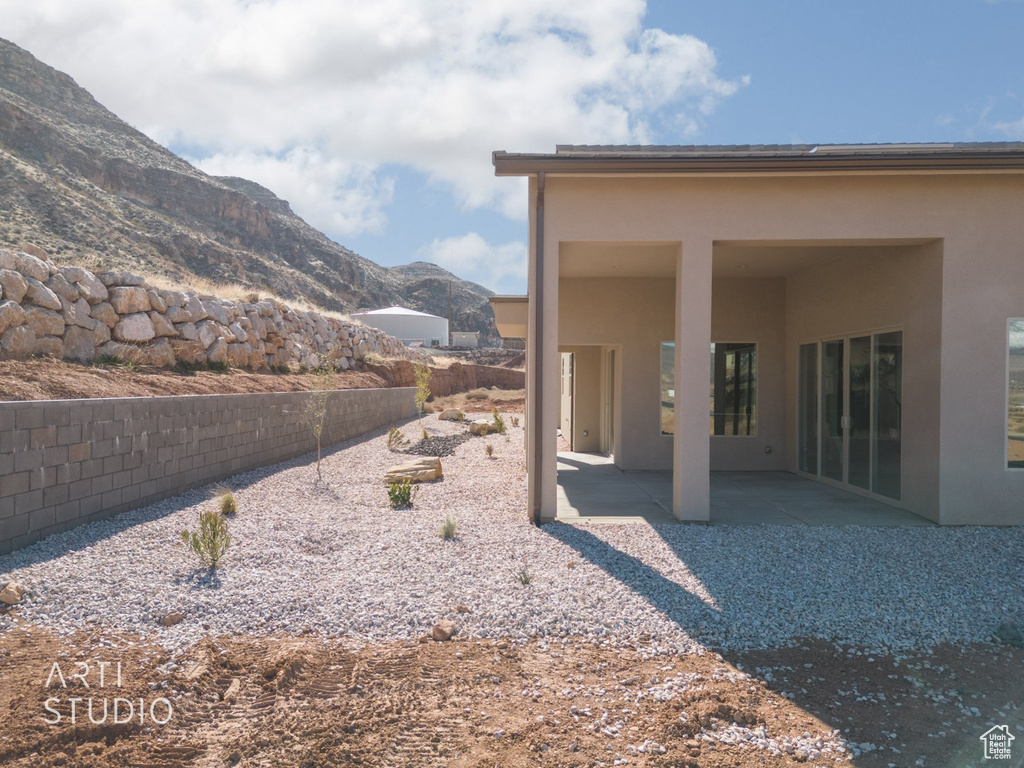 Exterior space with a patio area and a mountain view