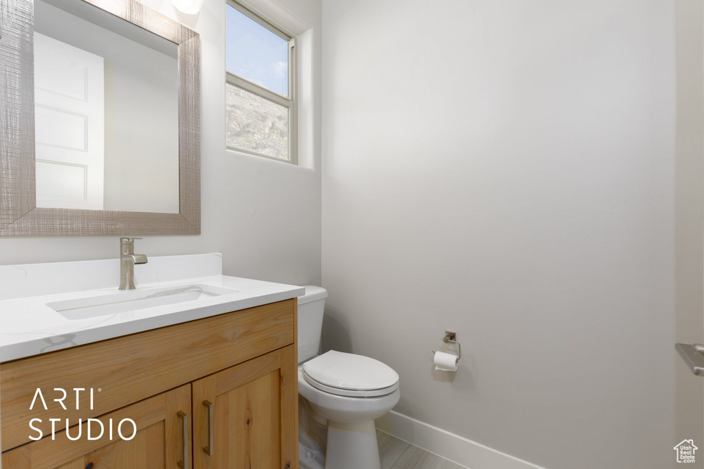 Bathroom with vanity and toilet