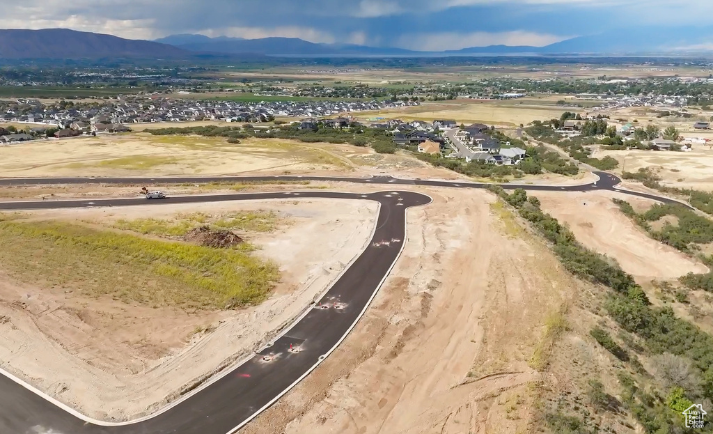 Birds eye view of property with a mountain view