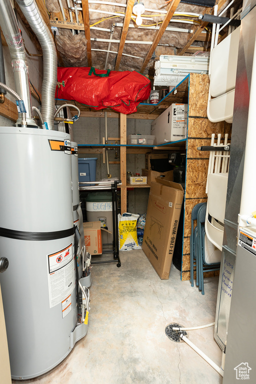 Interior space featuring strapped water heater