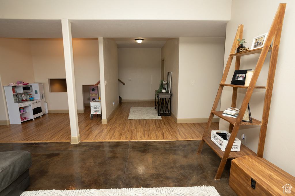 Interior space with dark hardwood / wood-style floors