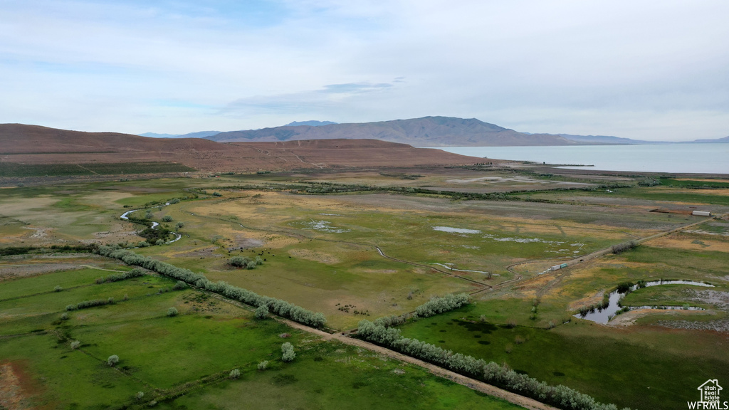 Drone / aerial view featuring a rural view and a water and mountain view