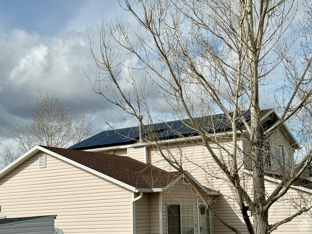 View of side of home with solar panels