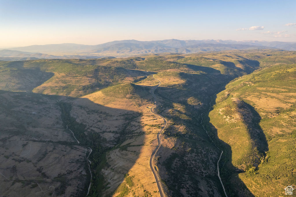 Aerial view at dusk featuring a mountain view