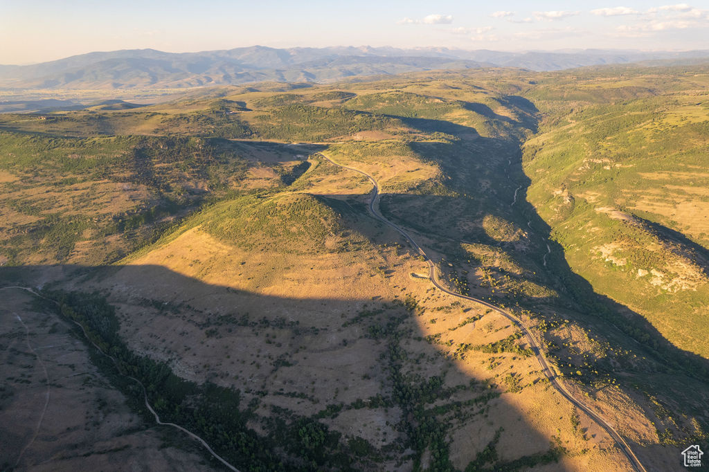 Aerial view at dusk featuring a mountain view