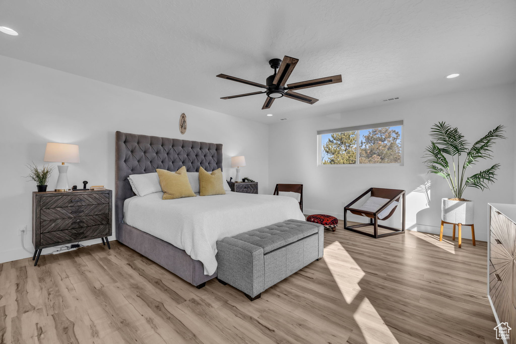 Bedroom featuring light wood-type flooring and ceiling fan