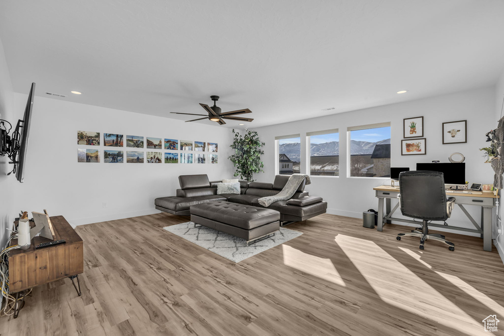 Interior space with light hardwood / wood-style flooring and ceiling fan