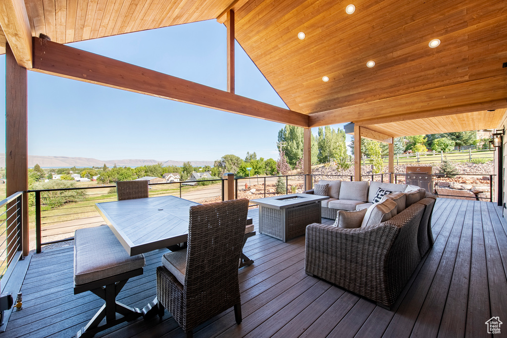 Wooden terrace featuring an outdoor hangout area