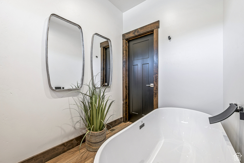 Bathroom with wood-type flooring
