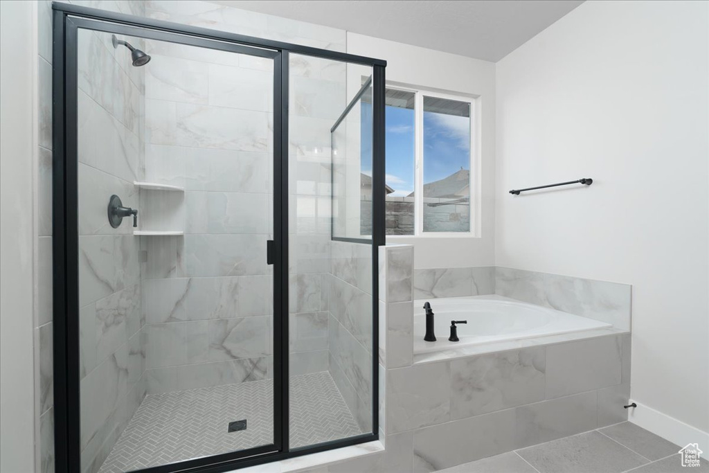 Bathroom with separate shower and tub and tile floors