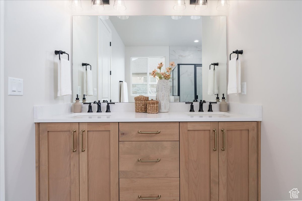 Bathroom featuring dual bowl vanity