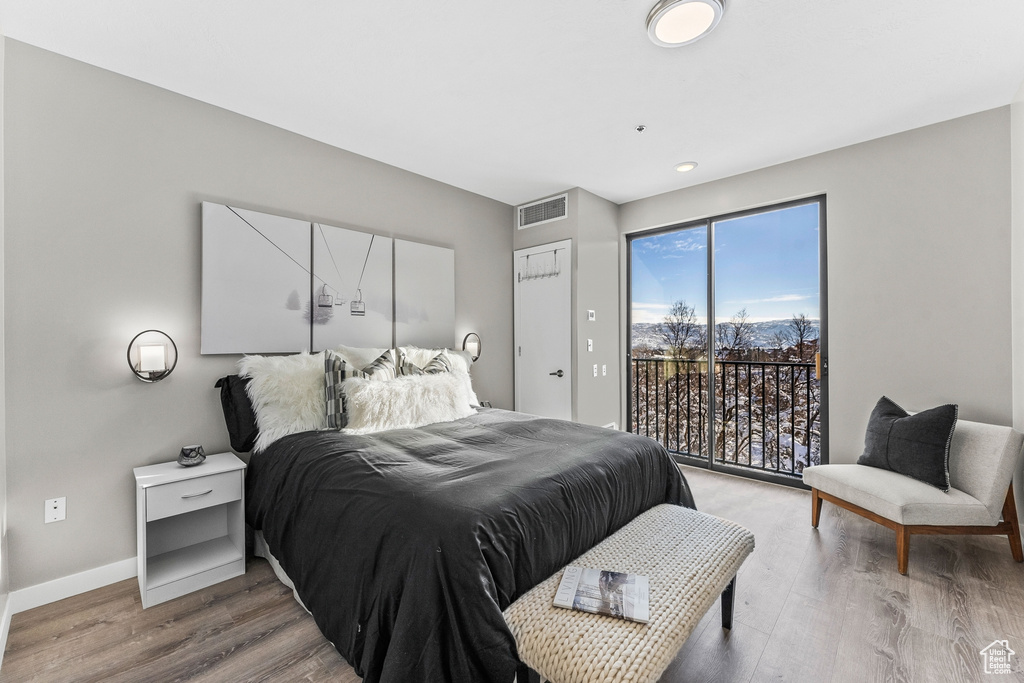Bedroom featuring light hardwood / wood-style floors and access to exterior