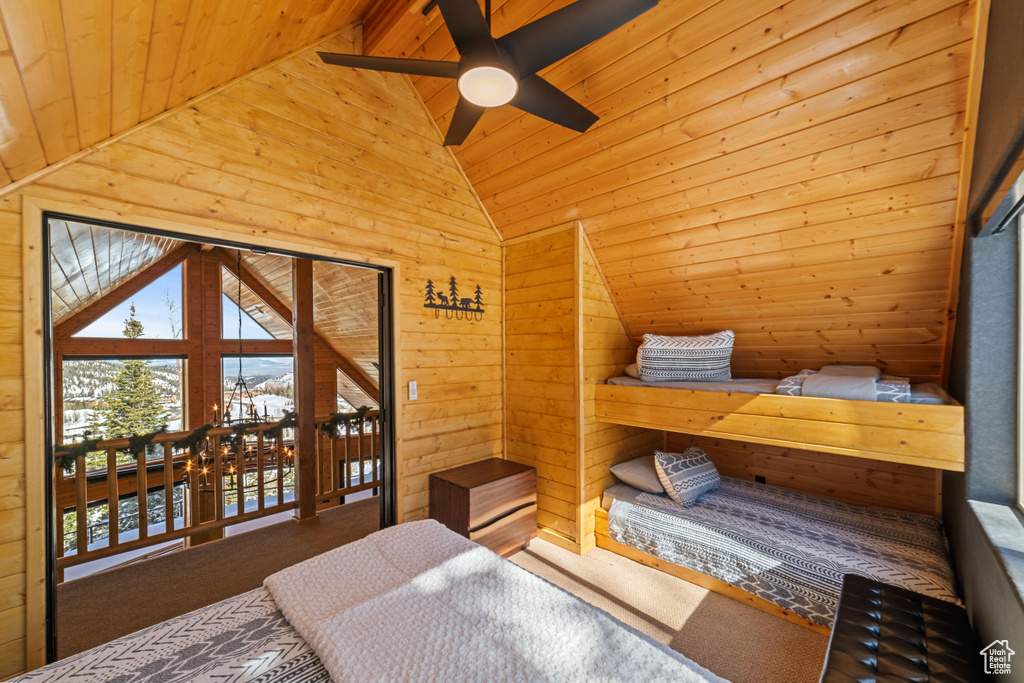 Bedroom featuring vaulted ceiling, carpet floors, ceiling fan, and wooden ceiling