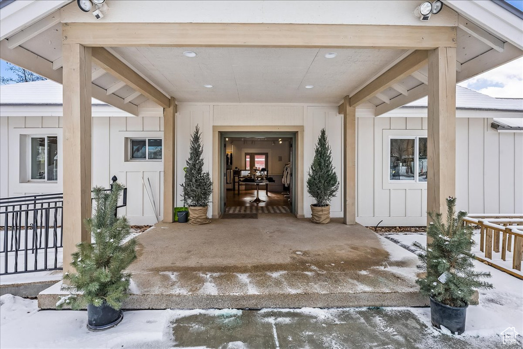 View of snow covered property entrance