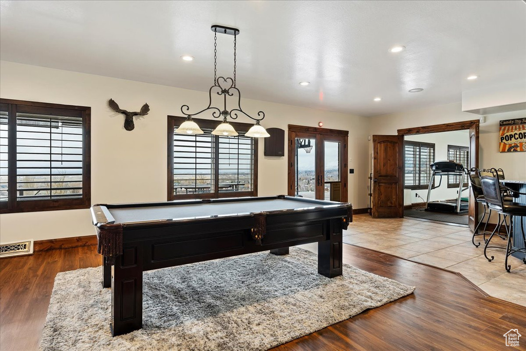 Rec room with light hardwood / wood-style floors, pool table, and french doors