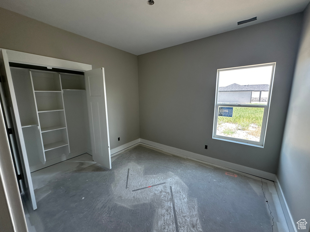 Unfurnished bedroom with a closet