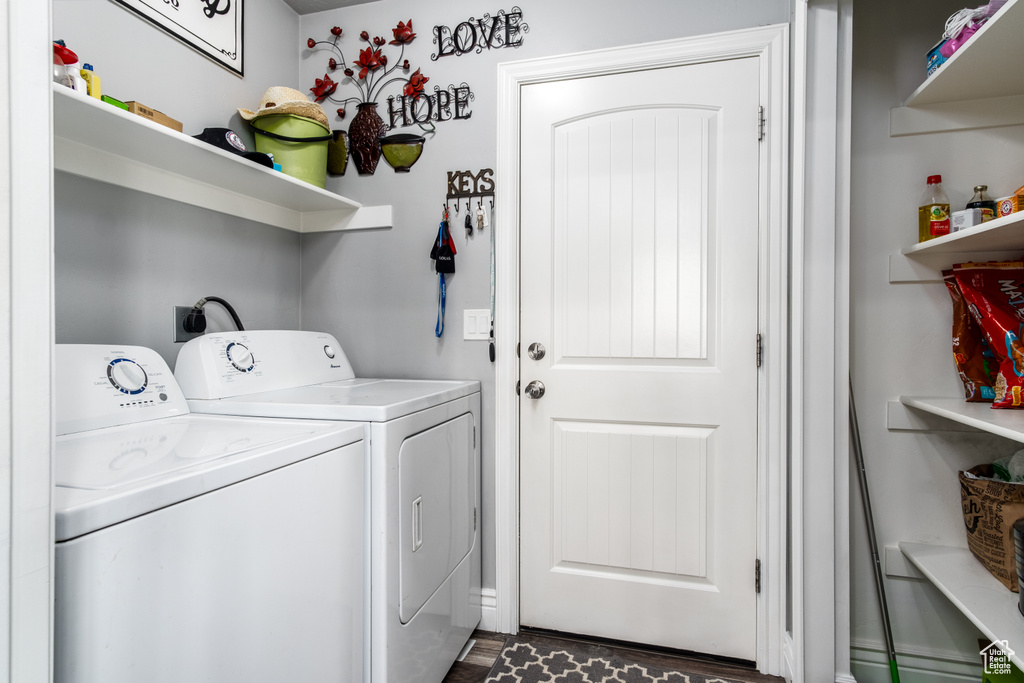 Laundry room featuring dark hardwood / wood-style floors, independent washer and dryer, and hookup for an electric dryer
