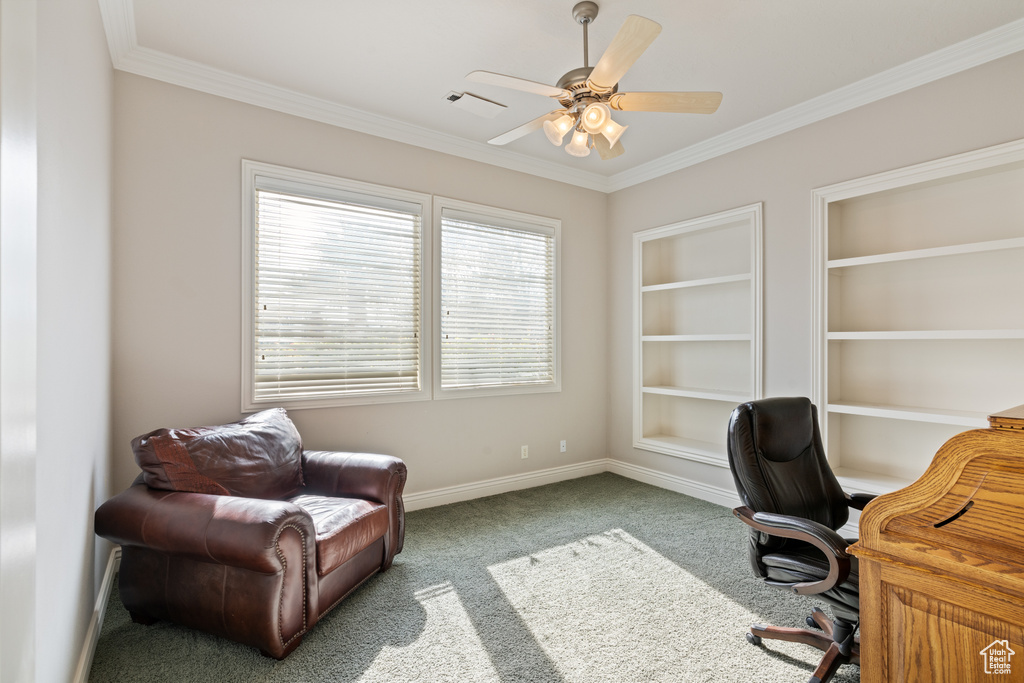 Office space featuring crown molding, ceiling fan, and light colored carpet
