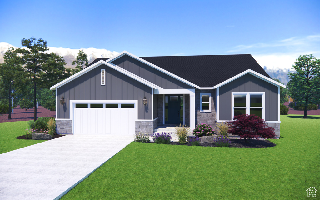 Craftsman inspired home with a front yard and a garage