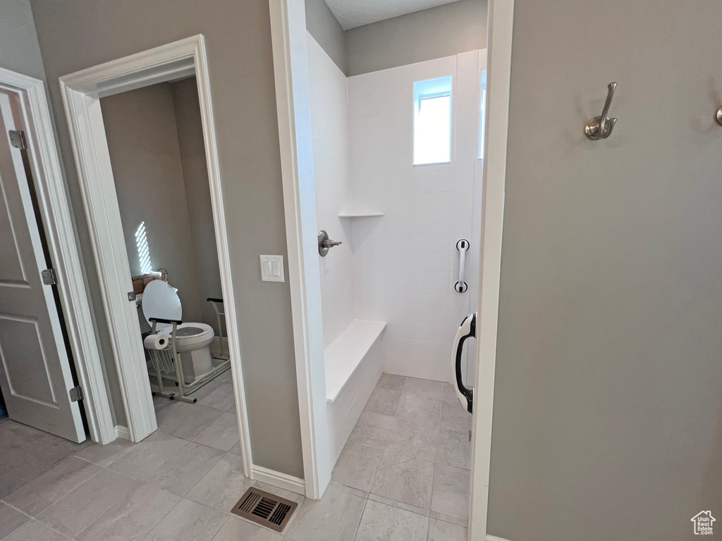 Bathroom with tile flooring
