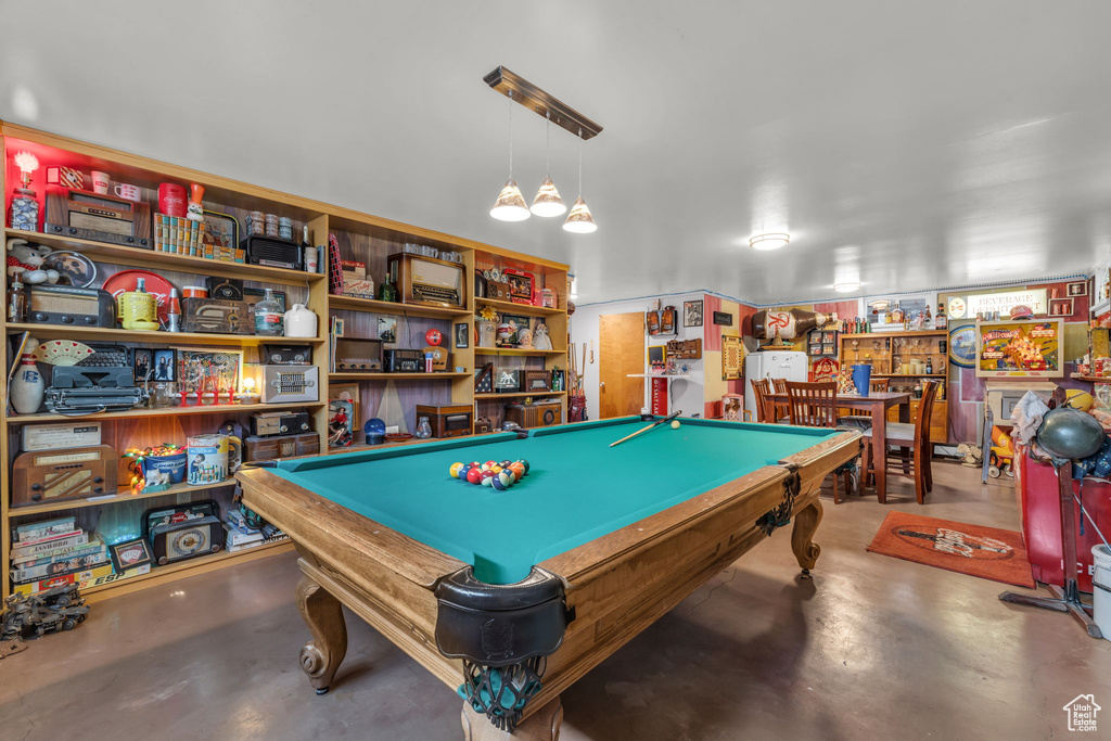 Rec room with concrete flooring and billiards