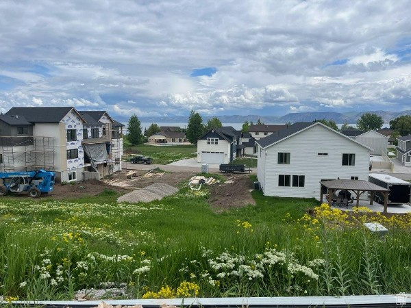 View of yard featuring a mountain view, a garage, and a gazebo