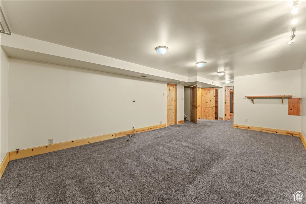 Basement with carpet flooring