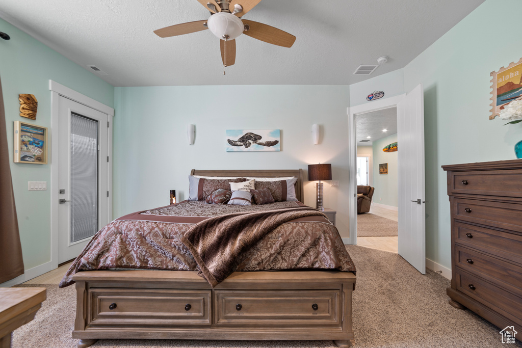 Bedroom featuring ceiling fan and light carpet