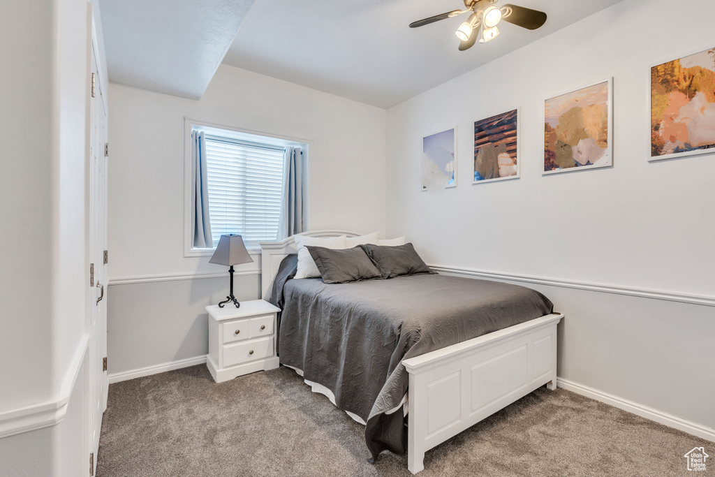 Bedroom with ceiling fan and carpet