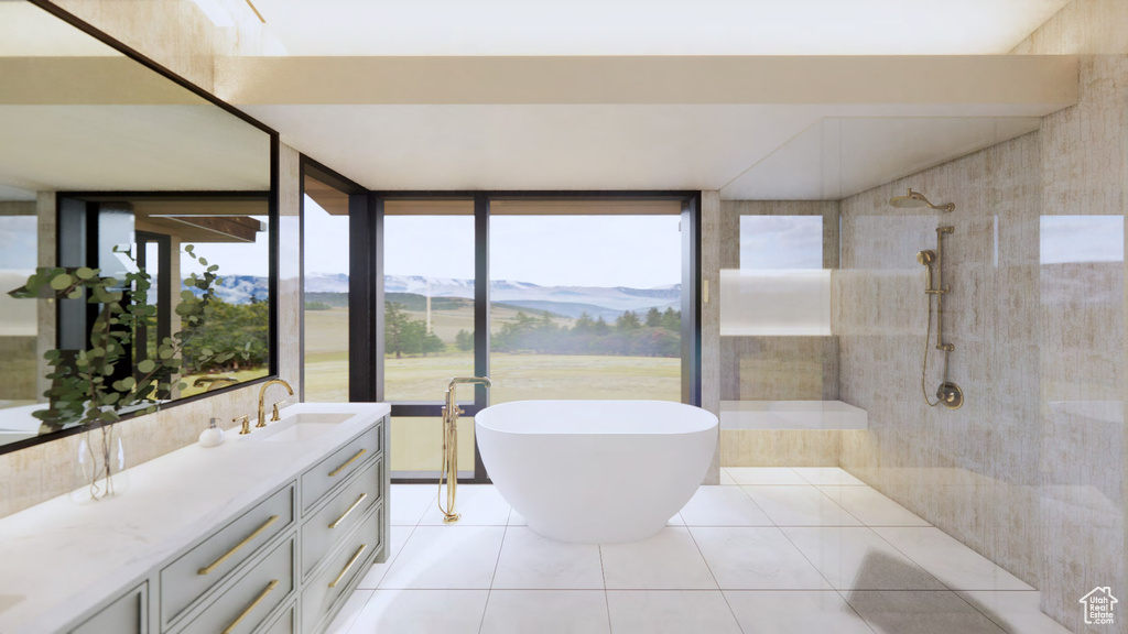 Bathroom featuring a mountain view, a healthy amount of sunlight, vanity, and tile flooring