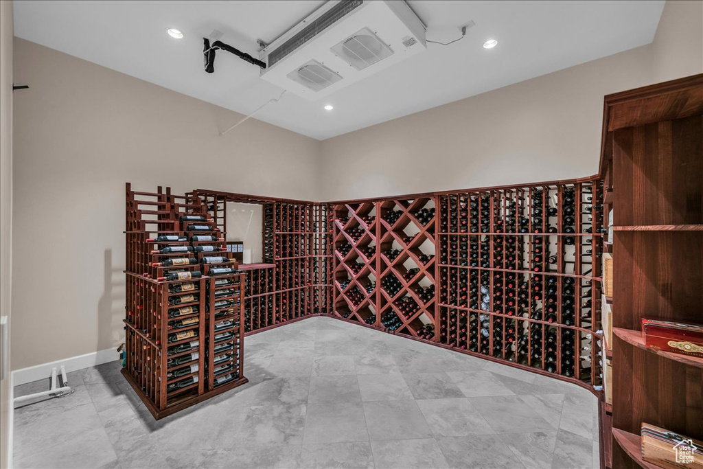 Wine cellar with light tile floors