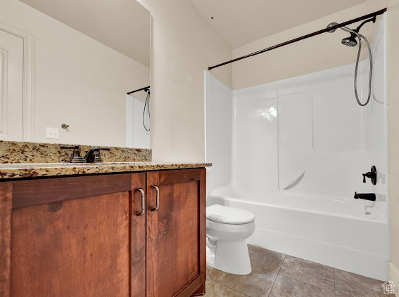 Full bathroom with vanity, toilet, shower / bath combination, and tile flooring