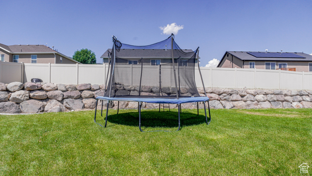View of yard with a trampoline