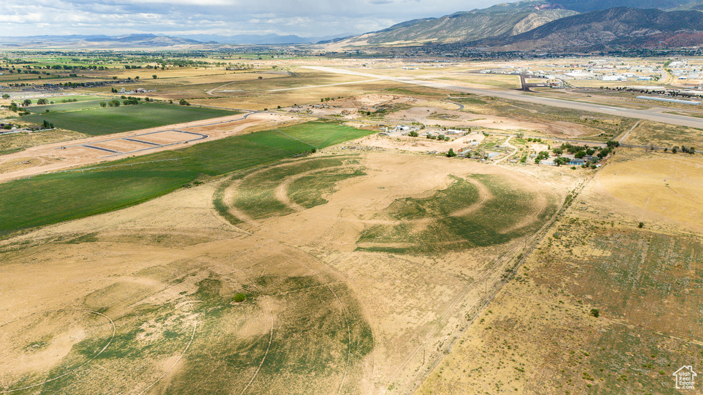 Birds eye view of property with a mountain view and a rural view