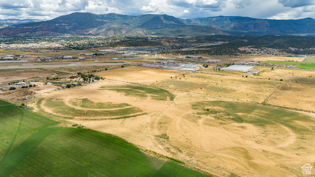 Aerial view featuring a rural view and a mountain view