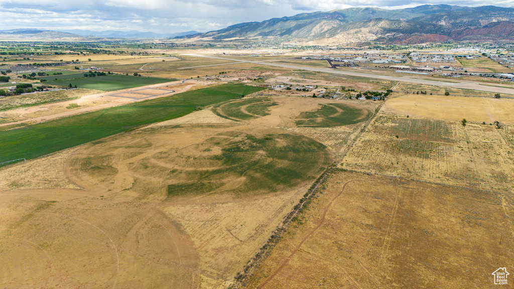 Birds eye view of property with a mountain view and a rural view