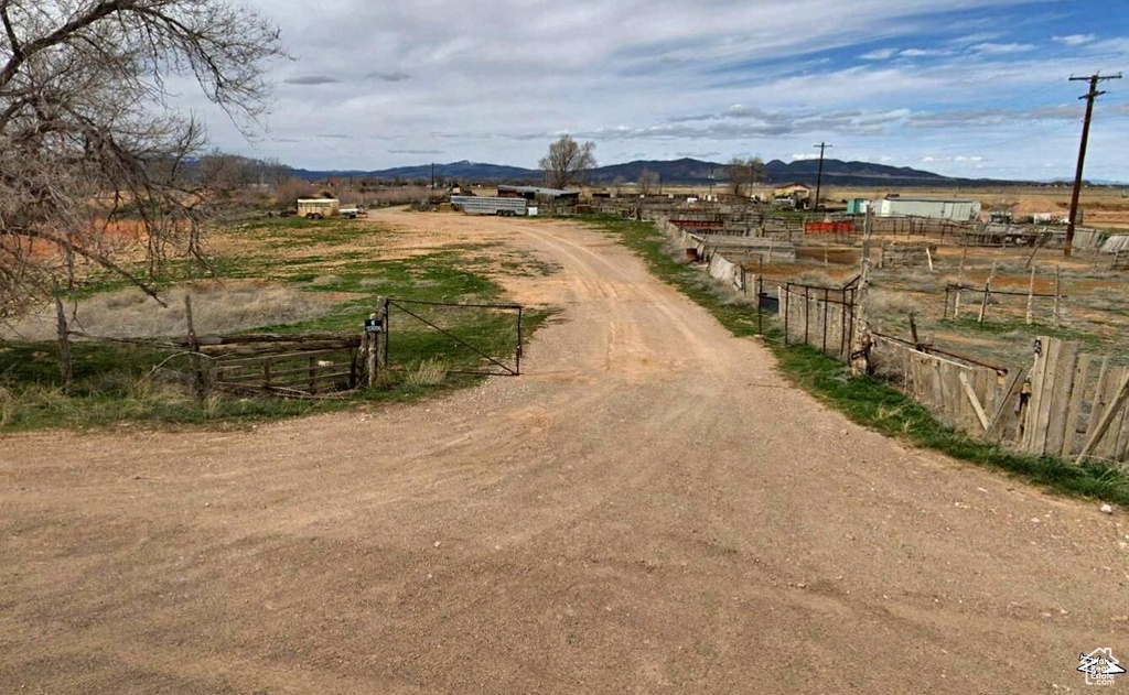 View of road with a rural view and a mountain view