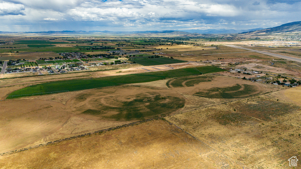 Birds eye view of property with a rural view and a mountain view