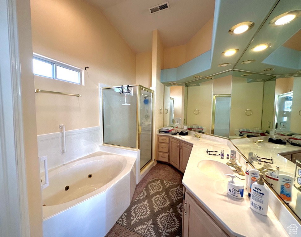 Bathroom with double vanity and plus walk in shower