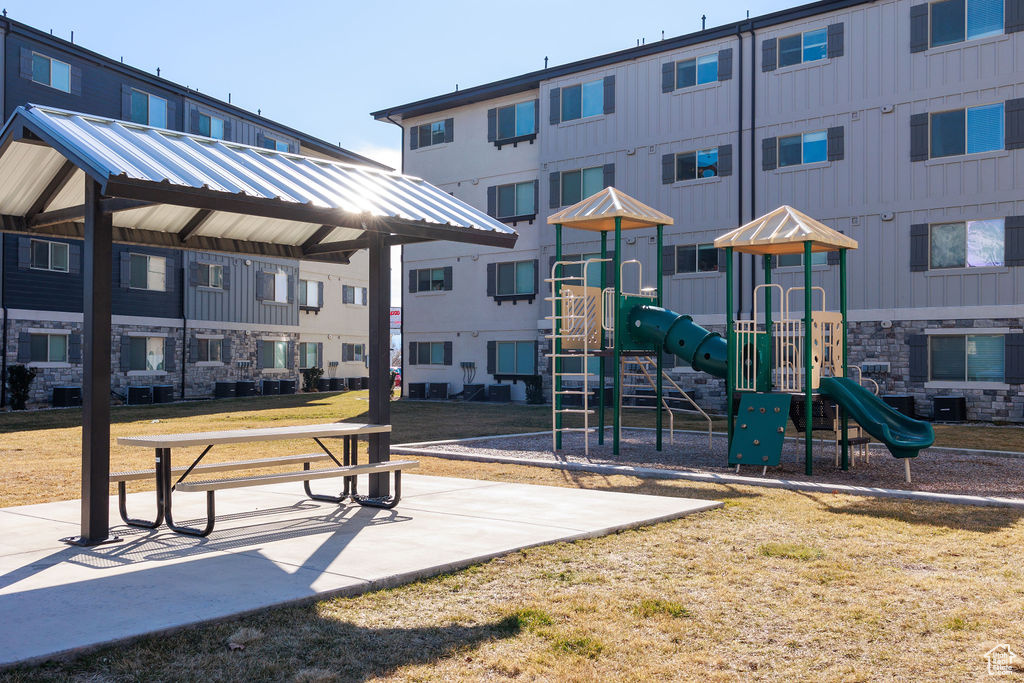 Surrounding community featuring a yard and a playground
