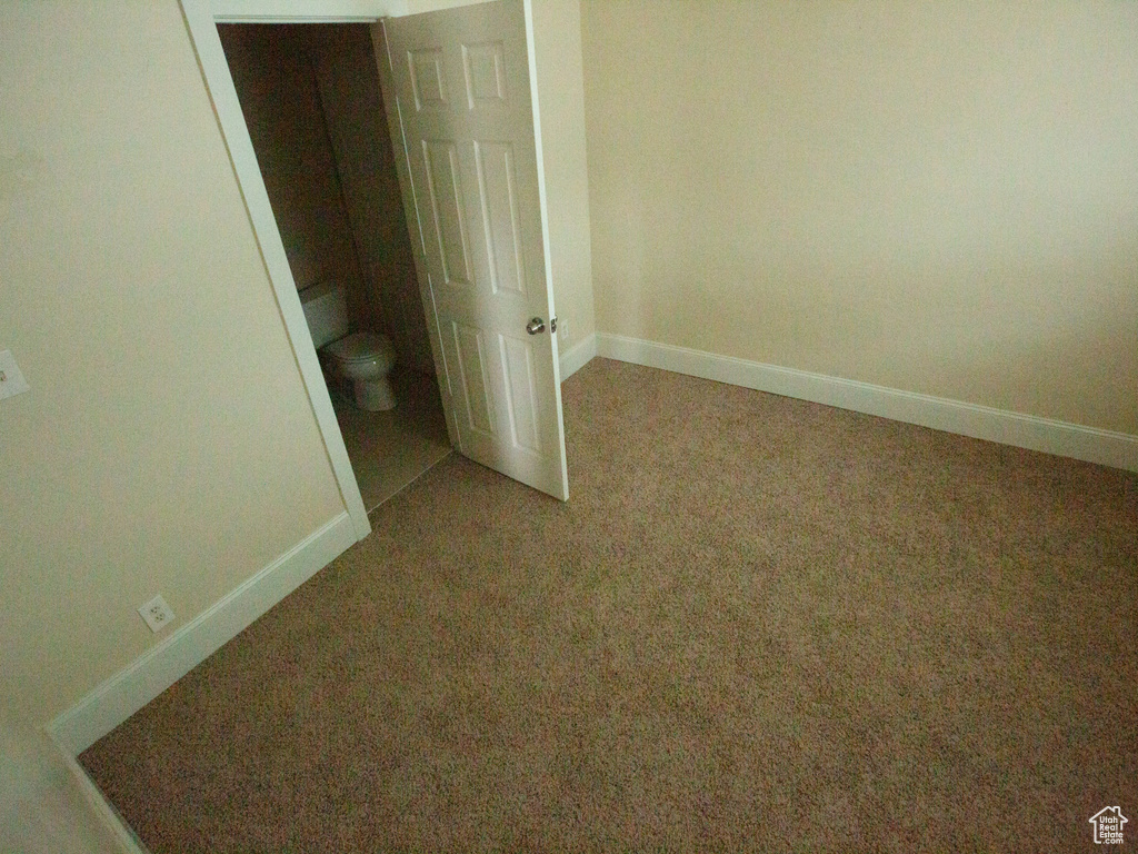 Unfurnished bedroom with carpet floors and a closet
