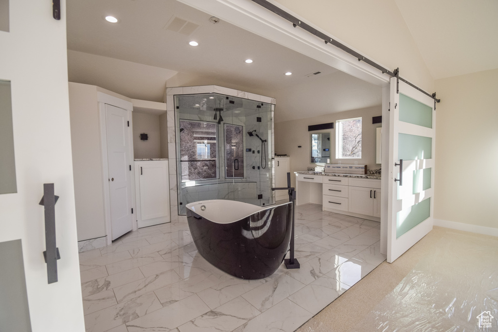 Bathroom with independent shower and bath, tile floors, and oversized vanity