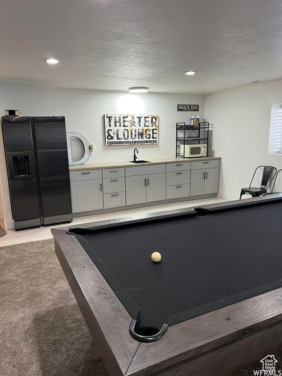 Playroom featuring sink, light carpet, and billiards